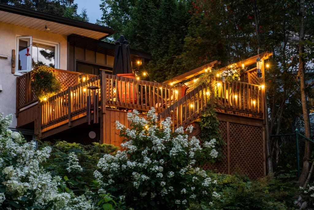 Wood deck overlooking a landscaped backyard